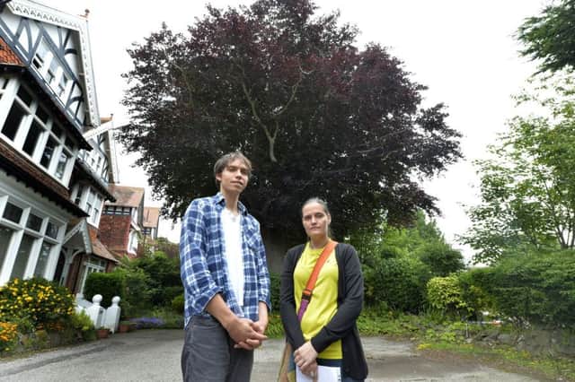 Zuan and Nikeata Cargnelutti in front of the protected tree in Upper Avenue, Eastbourne (Photo by Jon Rigby)