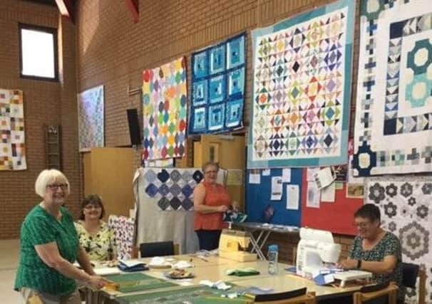 Handmade quilts which will be donated to children in care were on display at Horsham United Reformed Church SUS-190207-171812001