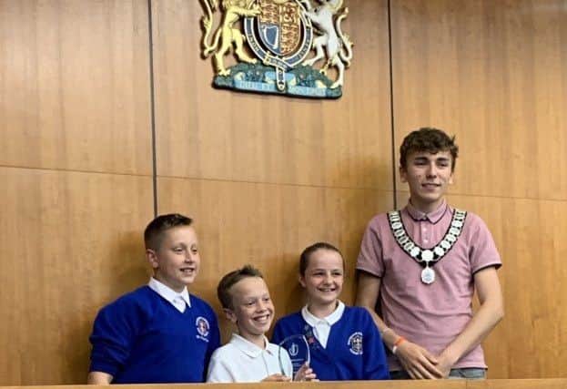 Worthing youth mayor Jimi Taylor with the winning team from Rustington Community Primary School