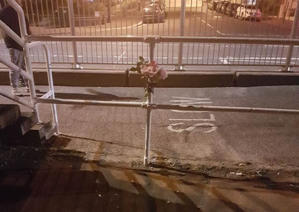 Flowers have been left at the scene. Picture: Charlotte Howard