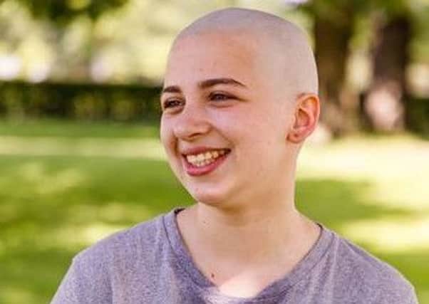 Christ's Hospital pupil Lydia Thornhill who is from Midhurst has shaved her head in memory of her mum and to raise funds for Kenyan school children SUS-190207-145823001