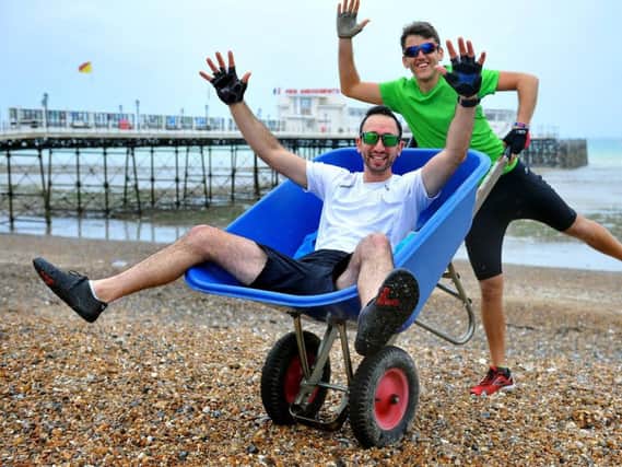 Theo Kyriacou and Nick Walraven are using a wheelbarrow to raise money for charity in a two day dash. Picture: Steve Robards