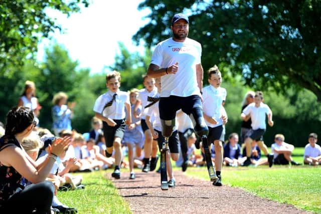 Paralympian Luke Sinnott opens the Daily Mile track at St Margaret's Primary School in Angmering. Picture: Steve Robards SR1917688