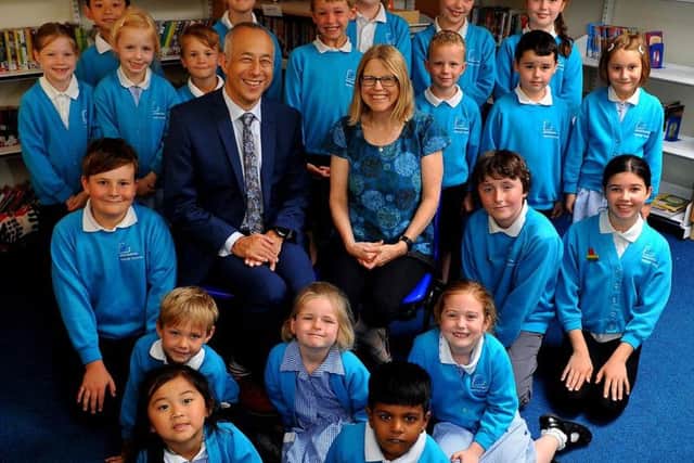 Jez Wong and his wife Kirsty with pupils at Broadwater CE Primary School in Worthing. Photo by Steve Robards