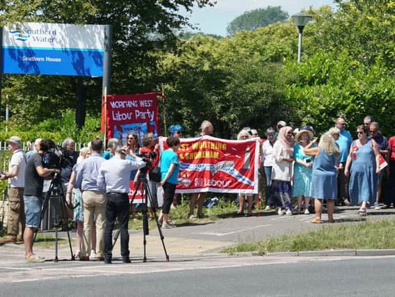 The protesters outside the headquarters in Worthing this afternoon