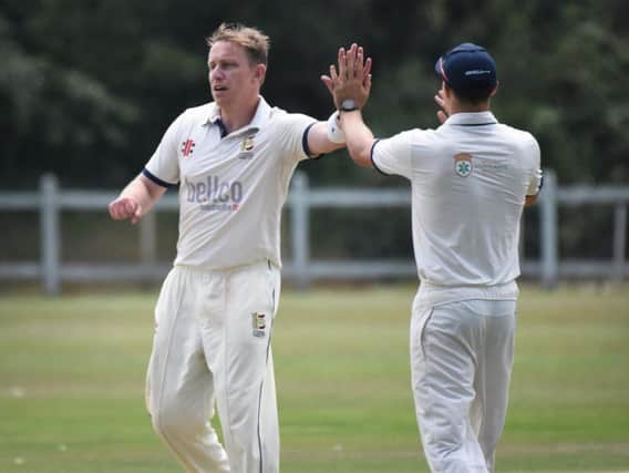 John Morgan celebrates a wicket for division 2 leaders Hastings. Picture by Justin Lycett