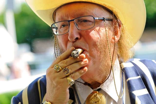 John McCririck lights up Goodwood - and lights up at Goodwood / Picture by Malcolm Wells