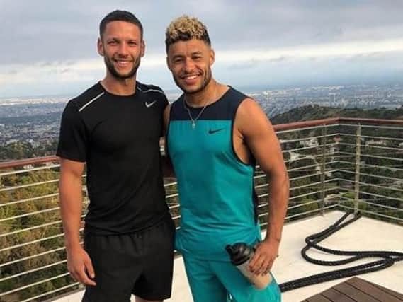 Alex Parsons (left) and Liverpool ace Alex Oxlade-Chamberlain. @_alexparsons_