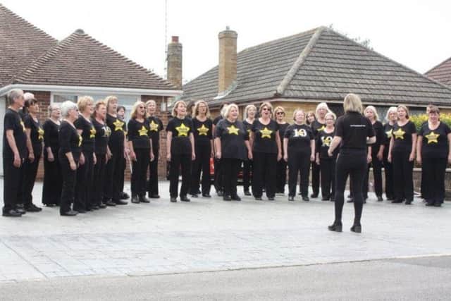 Worthing Rock Choir singing their hearts out in Cissbury Road, Ferring