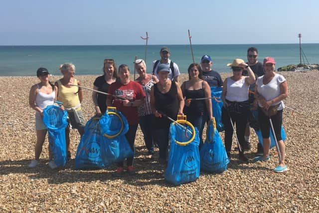Staff from Equiniti in Worthing supporting Surfers Against Sewage by clearing rubbish left on Goring beach