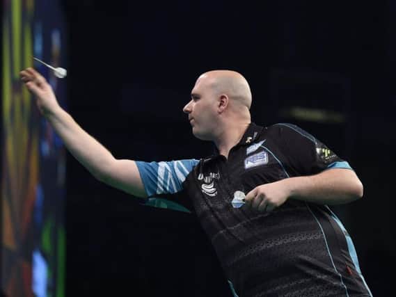Rob Cross in action against Daryl Gurney during the Unibet Premier League Darts at the SSE Arena, Belfast. Picture by Michael Cooper