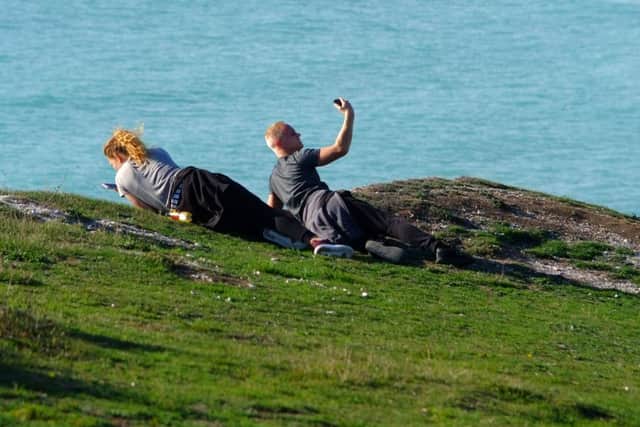 Tourists on Birling Gap cliff edge, photo by Peter Cripps