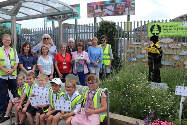 Friends of Angmering Station with representatives from West Sussex County Council by the bee-friendly garden created on the platform