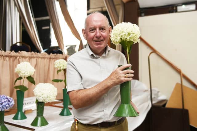 Jim Gray, chairman, with her hydrangea arborescens. Picture Liz Pearce LP190719