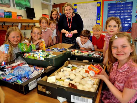 Children from Midhurst C of E Primary School packing donation boxes for the homeless by Donna Ockenden (founder of Four Streets Project). Pic Steve Robards SR1918241