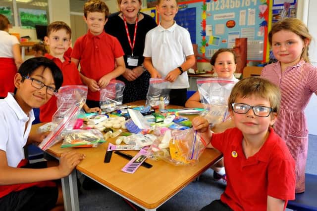 Children from Midhurst C of E Primary School packing donation boxes for the homeless by Donna Ockenden (founder of Four Streets Project). Pic Steve Robards SR1918247