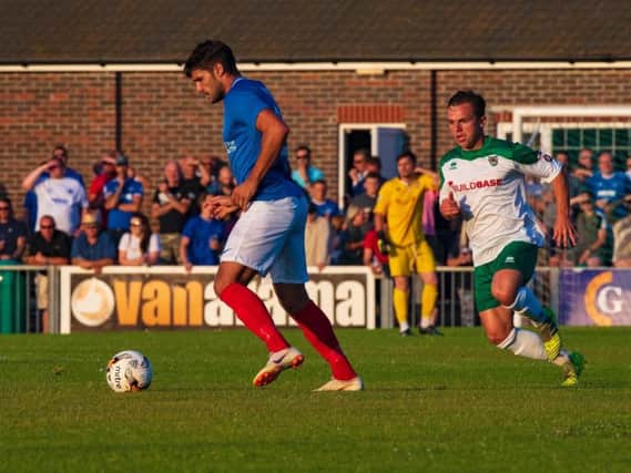 Calvin Davies tracks Gareth Evans during the Bognor-Pompey friendly of a year ago - the sides meet again this week but Davies is out, facing a long spell on the sidelines / Picture by Tommy McMillan