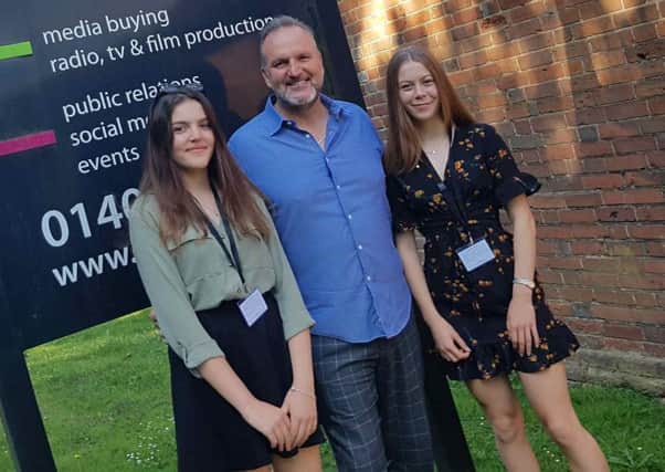 PMW Communications' managing director Peter Sutton with The Weald students Charlotte Tomlinson and Holly Greenfield SUS-190724-103743001