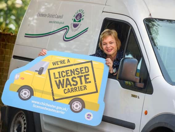 Councillor Penny Plant showing the symbol available to licensed wasted carriers.