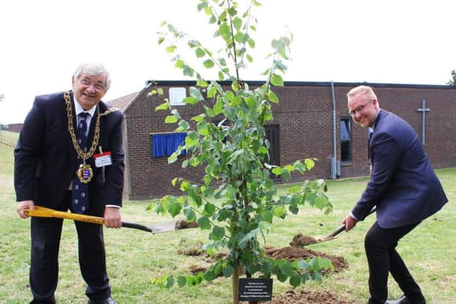 Mayor and deputy mayor of Hastings planting the commemorative lime tree