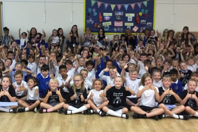 Pupils of Thomas A Becket Infant School celebrating their Ofsted result SUS-190723-081650001