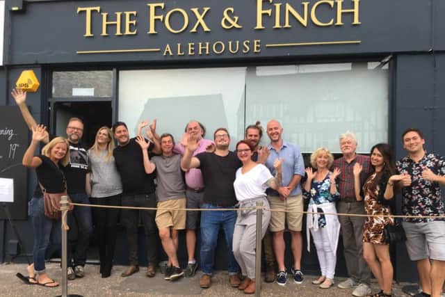 Owners Mike and Jo Saveen with business owners outside The Fox & Finch Alehouse on Wednesday (July 17)