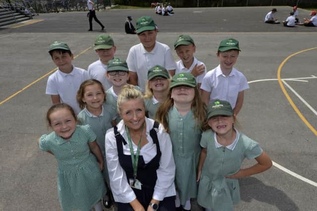 Head teacher Claire Martin-O'Donoghue and children celebrating Polegate School achieving flagship inclusion status (Photo by Jon Rigby) SUS-190718-103848008