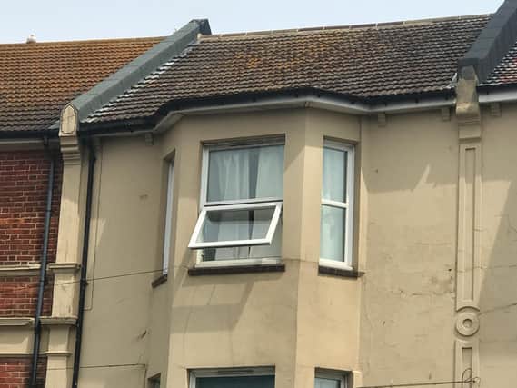 A woman was found dead in the flat in Bexhill