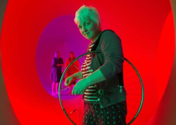 Sylvia plays the bicycle wheel