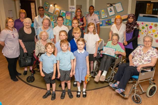 Holbrook Primary School children with residents and staff from Skylark House Care Home. Picture: Tony Kershaw SUS-190723-120530001