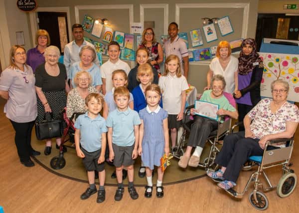 Holbrook Primary School children with residents and staff from Skylark House Care Home. Picture: Tony Kershaw SUS-190723-120530001