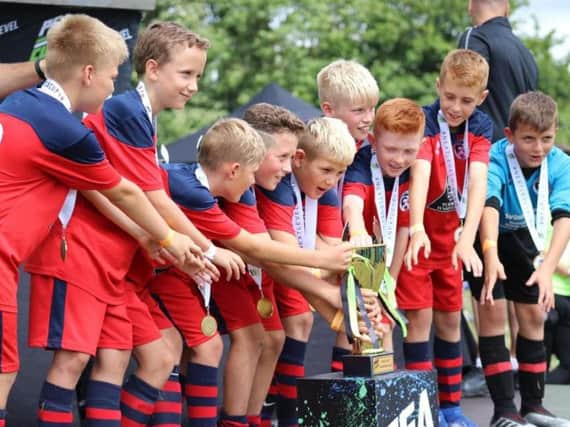Eastbourne United under 10's lift a trophy. All pictures courtesy of Mark Newnham-Reeve.