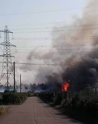 Fire on Lydd Ranges. Photo by Sueann Barnsey. SUS-190723-191610001