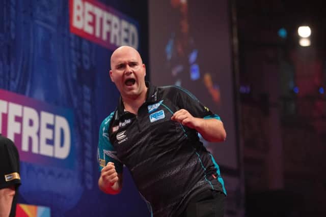 Rob Cross celebrates. Picture by Lawrence Lustig/PDC