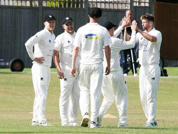 Roffey celebrate picking up a wicket during their home win over Three Bridges. All pictures by by Derek Martin Photography