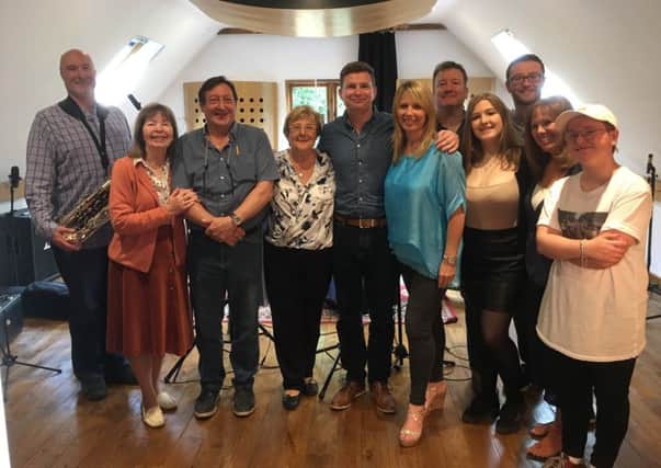Part-time teaching assistant and musician Sarah Rolph gathered members of her family to record the song together in honour of her father, Doug, who died from pulmonary fibrosis four years ago.