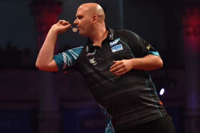 Rob Cross in action against Daryl Gurney. Chris Dean/PDC