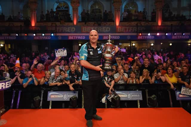 Rob Cross with the trophy. Picture by Chris Dean/PDC
