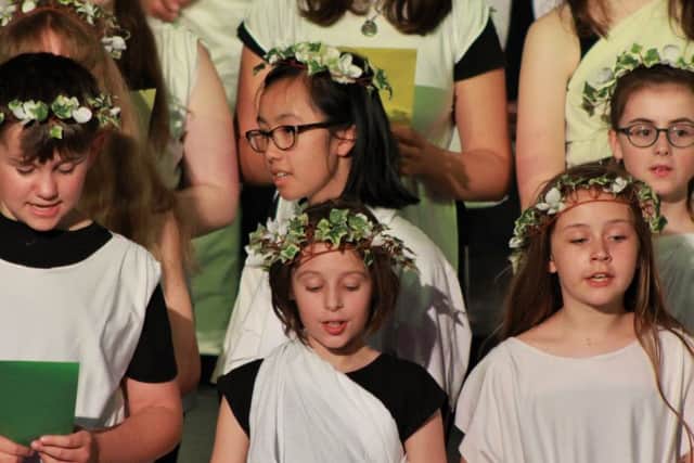 The choir, dressed in togas with vine leaf headbands for the Labours of Hercules