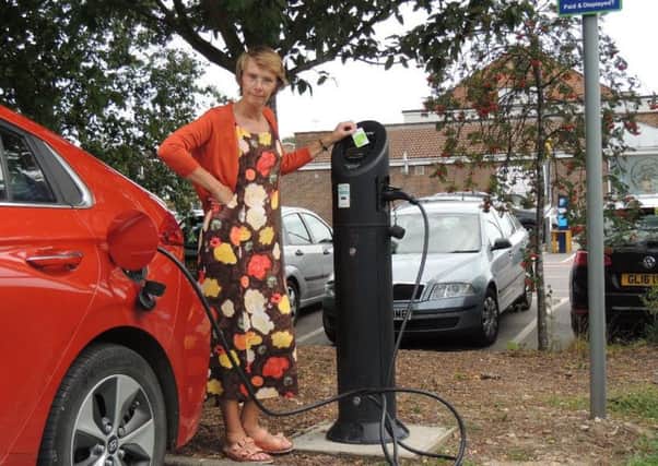 Green councillor Anne Eves at the broken electric vehicle charging point at the Cyprus Road car park in Burgess Hill