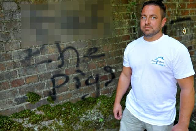 Allan Peters at the Railway bridge off Deane Road, Horsham where he's found that someone has sprayed rude grafitti. Pic Steve Robards SR1918692 SUS-190729-170430001