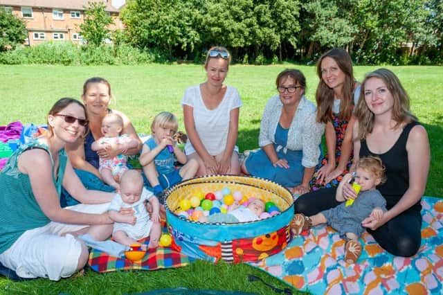 Wick, Littlehampton, Sussex, UK. 29th July 2019. Parents/ Carers and their babies attended the Wick Week Prams In The Park With Familes In Mind event at Water Lane, Wick. In Photo: Visitors enjoy the event.