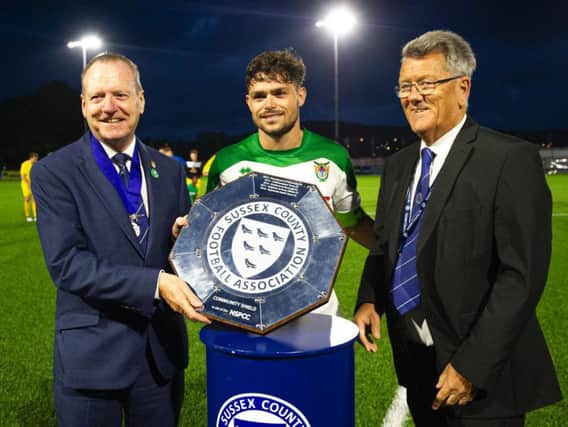 Rocks skipper Harvey Whyte with the community shield / Picture by Tommy McMillan