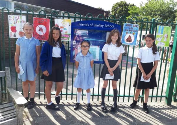 The five winners with their designs in the poster competition - Natalie Dimitrova, Victoria Hayda, Emilia Hazelgrove, Scarlett MacDonald and Amelia OHalloran from Shelley primary School, Broadbridge Heath SUS-190731-111154001