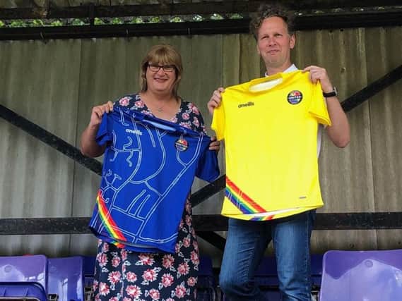 Sophie Cook andDavid Shrigley with the Rainbow Rovers shirt
