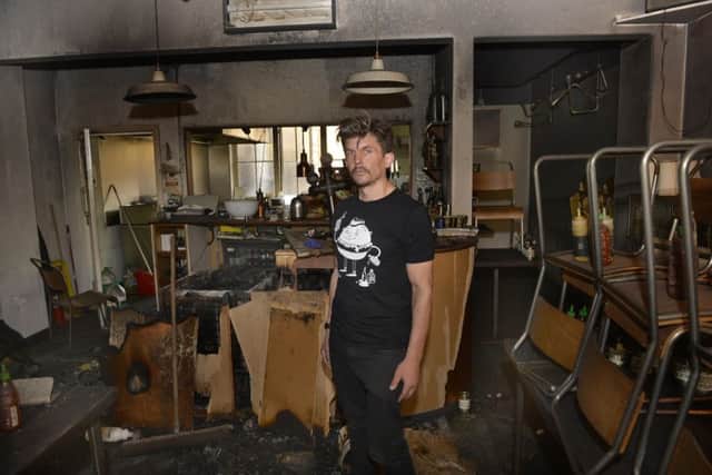 Fire has caused extensive damage at Half Man! Half Burger! restaurant in Grove Road, Eastbourne. Pictured is owner Matt Woodhouse (Photo by Jon Rigby)
