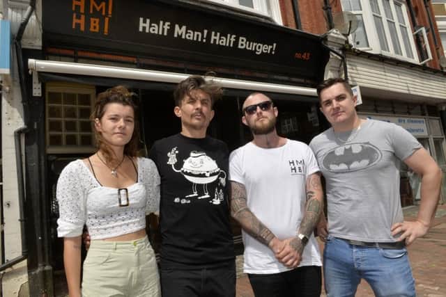 Fire has caused extensive damage at Half Man! Half Burger! restaurant in Grove Road, Eastbourne. Pictured is owner Matt Woodhouse with Jade Leman, Caine Hemmingway and Max Blackford (Photo by Jon Rigby)