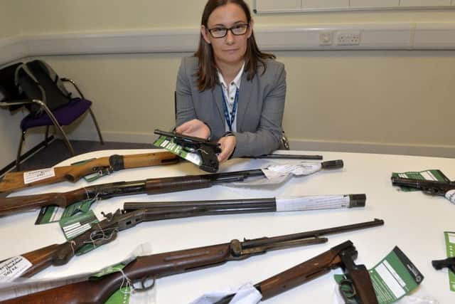 DI Vanessa Britton with some of the firearms which have been handed in across Sussex