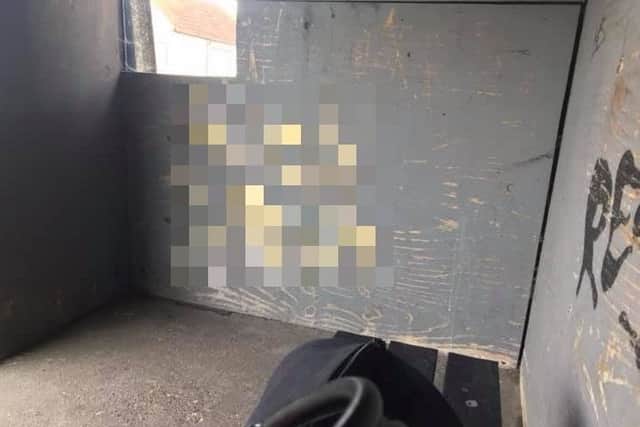 An abusive phrase, which has been pixelated to avoid offence, was daubed on the wall of the bus shelter. Picture courtesy of Jonathan Swain