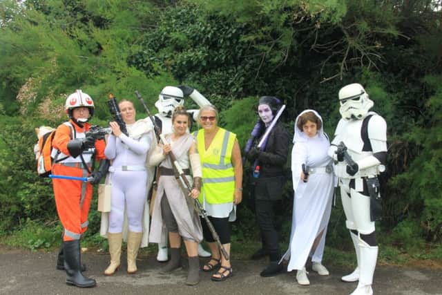 Some of the costumed characters for the promenade walk with Worthing Rotary Club president Marlene Butler